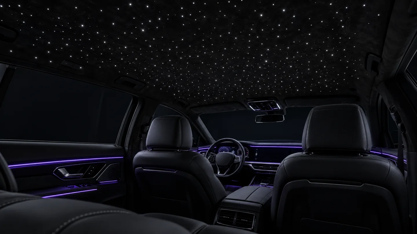 AI concept of white fiber-optic stars installed across a black vehicle headliner.
