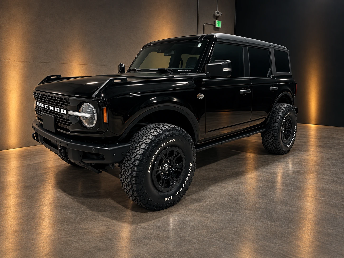 Front three-quarter view of a black Ford Bronco inside the PLM studio