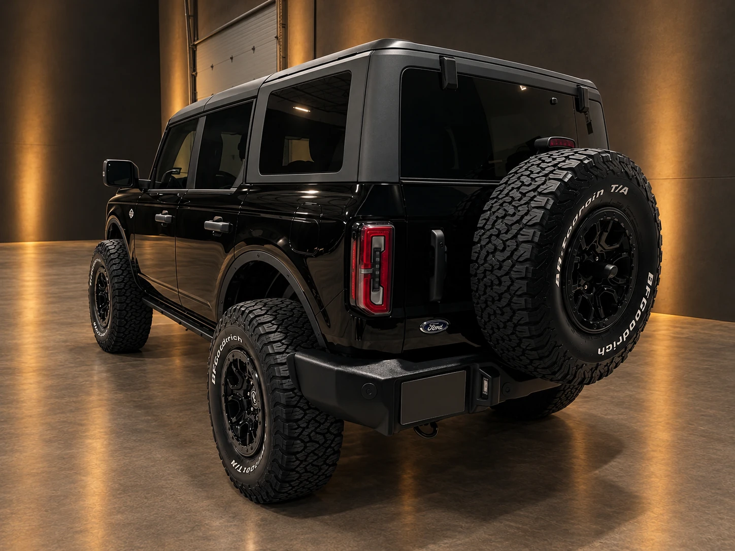 Rear three-quarter view of a black Ford Bronco inside the PLM studio